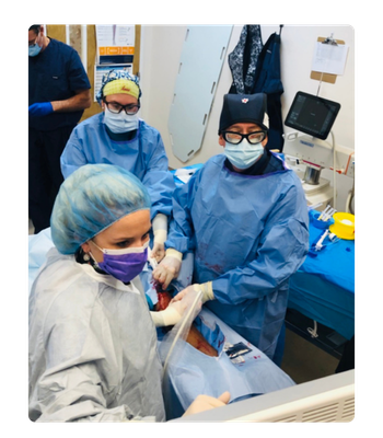 AVA-Doctors and nurses performing vascular procedure on leg