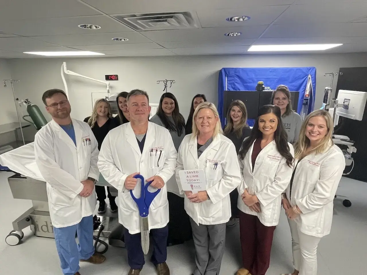 NMVC Ribbon Cutting Ceremony - a group of doctors in white lab coats posing for a photo